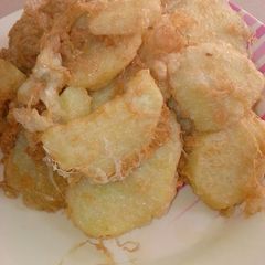 A picture of Fried sweet potatoes an egg.