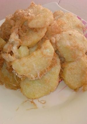 A picture of Fried sweet potatoes an egg.
