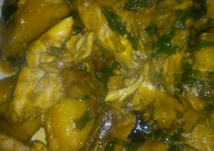 Porridge plantain with scent leaf and smoked fish