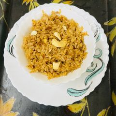 A picture of Coconut Rice with Jaggery.