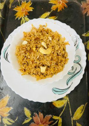 A picture of Coconut Rice with Jaggery.