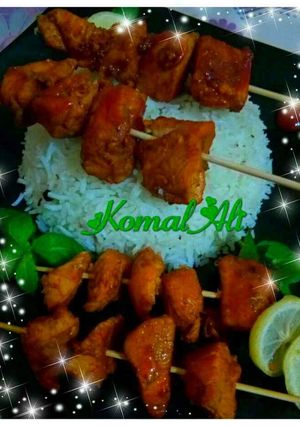 A picture of Chicken Stick kabab with simple Tarka white Rice.