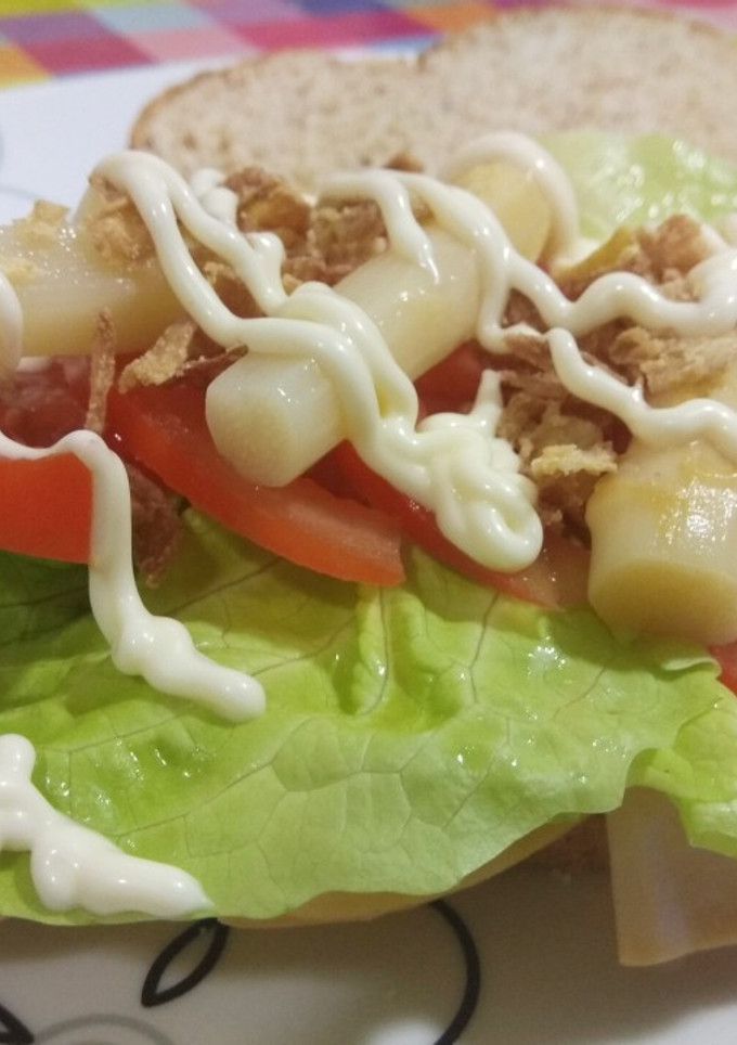 Una foto de Sándwich mixto+vegetal