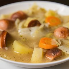 A picture of Cabbage and sausage soup.