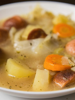 A picture of Cabbage and sausage soup.
