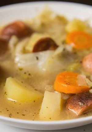A picture of Cabbage and sausage soup.