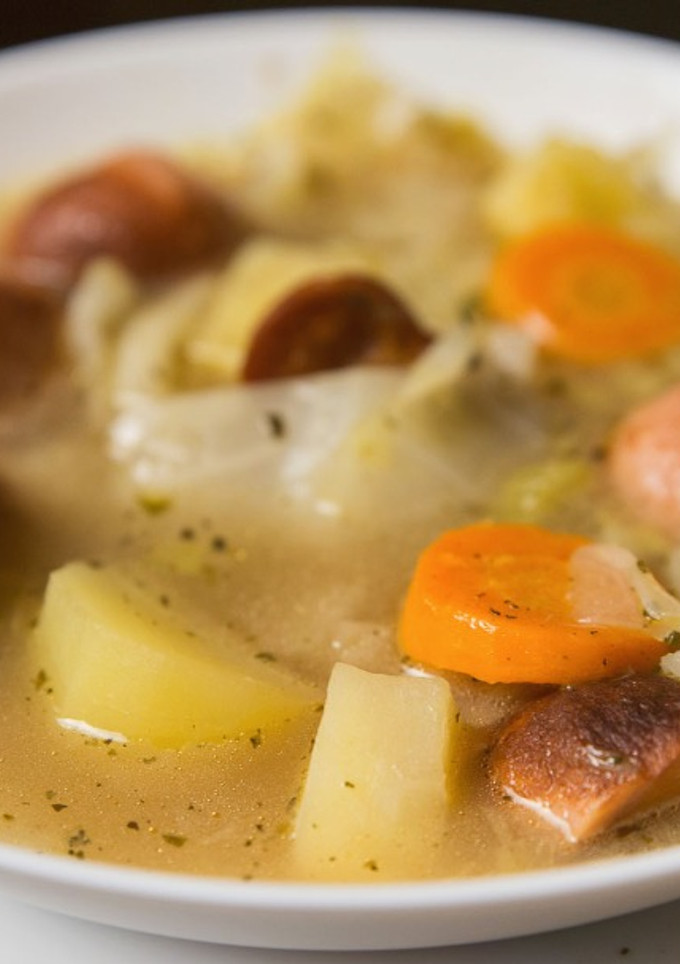 A picture of Cabbage and sausage soup.