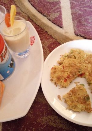 A picture of Indomie pizza with milk shake mixture.