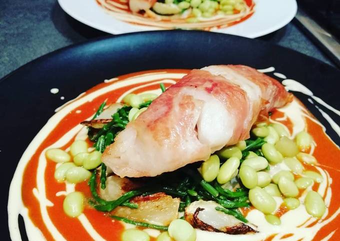Monkfish wraped in parma ham with tomato and hummous sauce