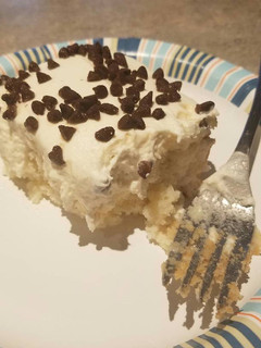 A picture of Cannoli poke cake.