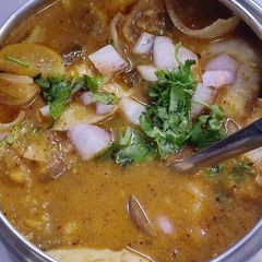 A picture of Kutti idli with sambar and chutney for lunch box.