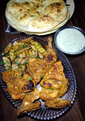 A picture of Chicken Masala Tikka with Grilled Potato Wedges.