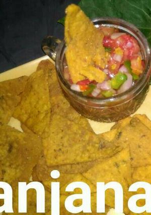 A picture of Tangy salsa with multigrain aachari nachos...