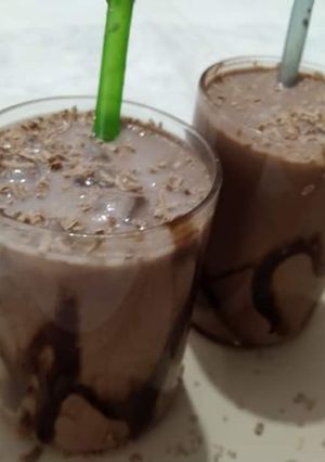 A picture of Cold coffee with chocolate syrup.