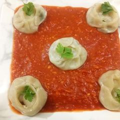 A picture of Steamed Cheese Momos.