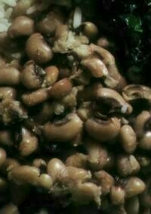 A picture of Plain bean and rice with vegetable.