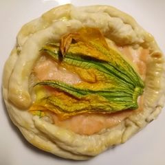 A picture of Smoked salmon and pumpkin flower tart.