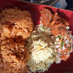 A picture of Jollof and curry rice.