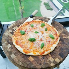Thin crust home pizza A picture of Thin crust home pizza.