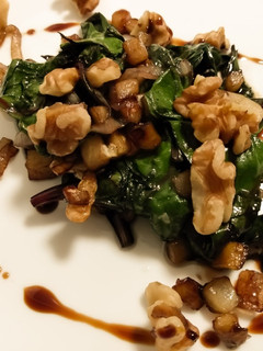 A picture of Sauteed beet greens with apple, walnuts, and balsamic.