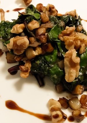 A picture of Sauteed beet greens with apple, walnuts, and balsamic.