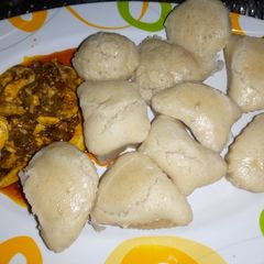 A picture of Alkubus with onion and egg sauce.