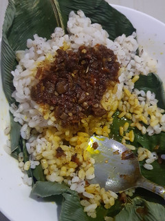 A picture of Ofada rice and ofada stew.