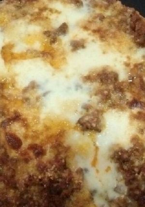Una foto de Polenta con queso a la boloñesa