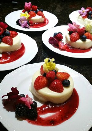 A picture of Vanilla Panna Cotta & Berry Coulis.