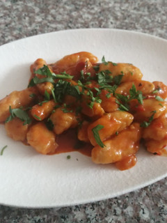 A picture of Gnocchi in tomato sauce.