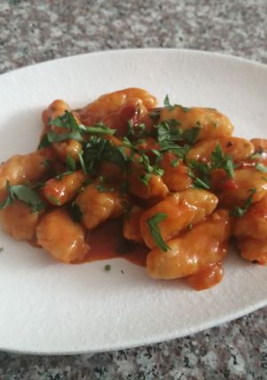 A picture of Gnocchi in tomato sauce.