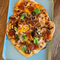 A picture of Thin and crispy pizza with homemade tomato passata.