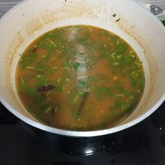 A picture of Rasam (spicy tomato and coriander stew).