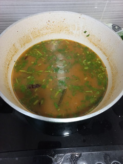 A picture of Rasam (spicy tomato and coriander stew).