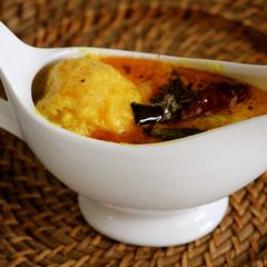 A picture of Mambhazha Pulliserry (Sweet Mango in Coconut and yoghurt sauce).