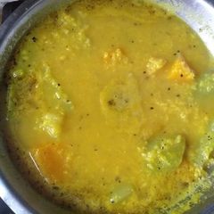 A picture of Raw moong daal with pumpkin and bottle gourd.
