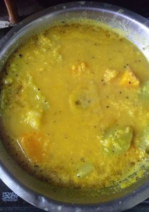 A picture of Raw moong daal with pumpkin and bottle gourd.