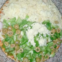 A picture of Green and white pizza.