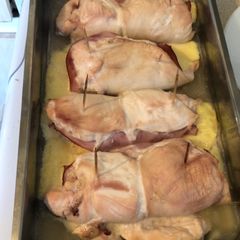 A picture of Rolled smashed chicken with ham and cheese.