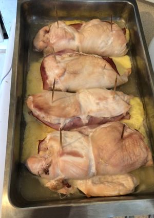 A picture of Rolled smashed chicken with ham and cheese.