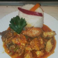 A picture of Fried chicken served with rice.