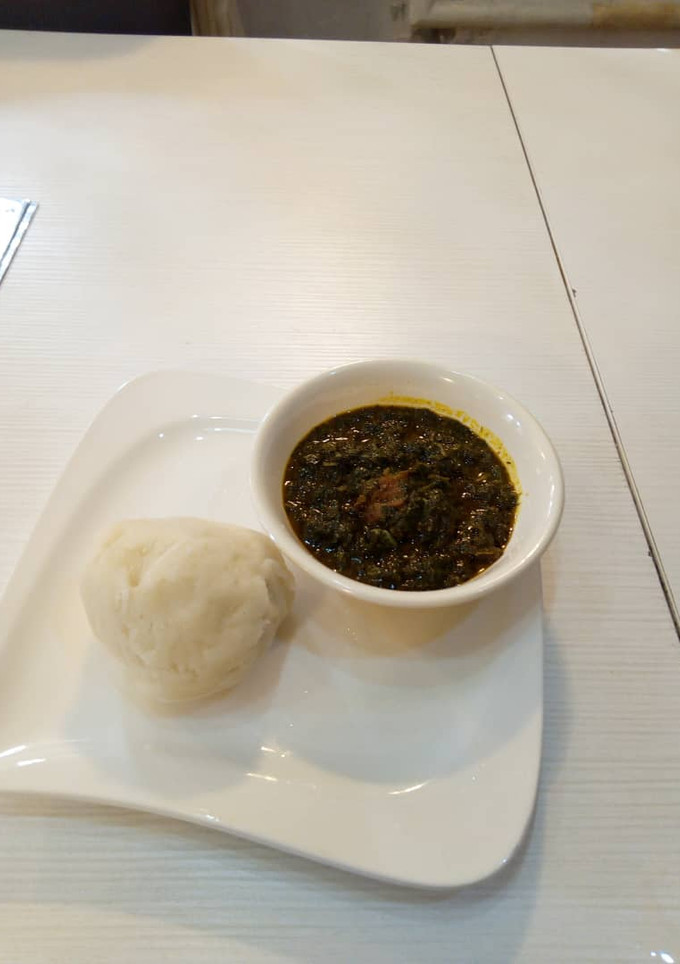 A picture of Afang Soup with fufu.