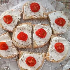 A picture of Bruschetta with goat's cheese, honey and thyme.