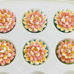 A picture of Eggless cupcakesDecorated with buttercream, fondant and marshmallows.