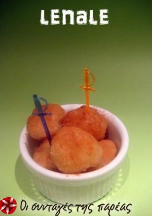 A picture of Loukoumades with honey.