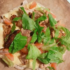 A picture of Chicken Lettuce Tomato Pizza.