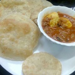 A picture of Poori with Egg Roast.