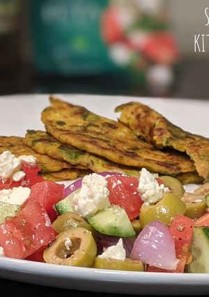 A picture of Cucumber and Spinach Pancakes with Greek Salad.