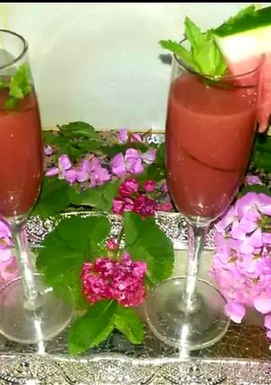 A picture of Red watermelon juice, mint and lemon juice.