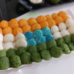 A picture of Tiranga Idli buttons.
